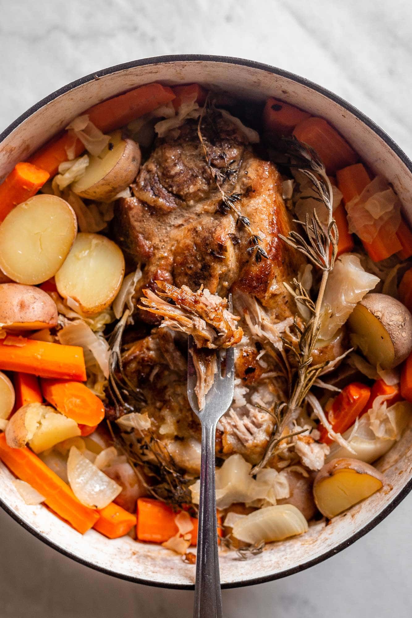 Slow Cooked Pork Roast With Sauerkraut Potatoes And Carrots