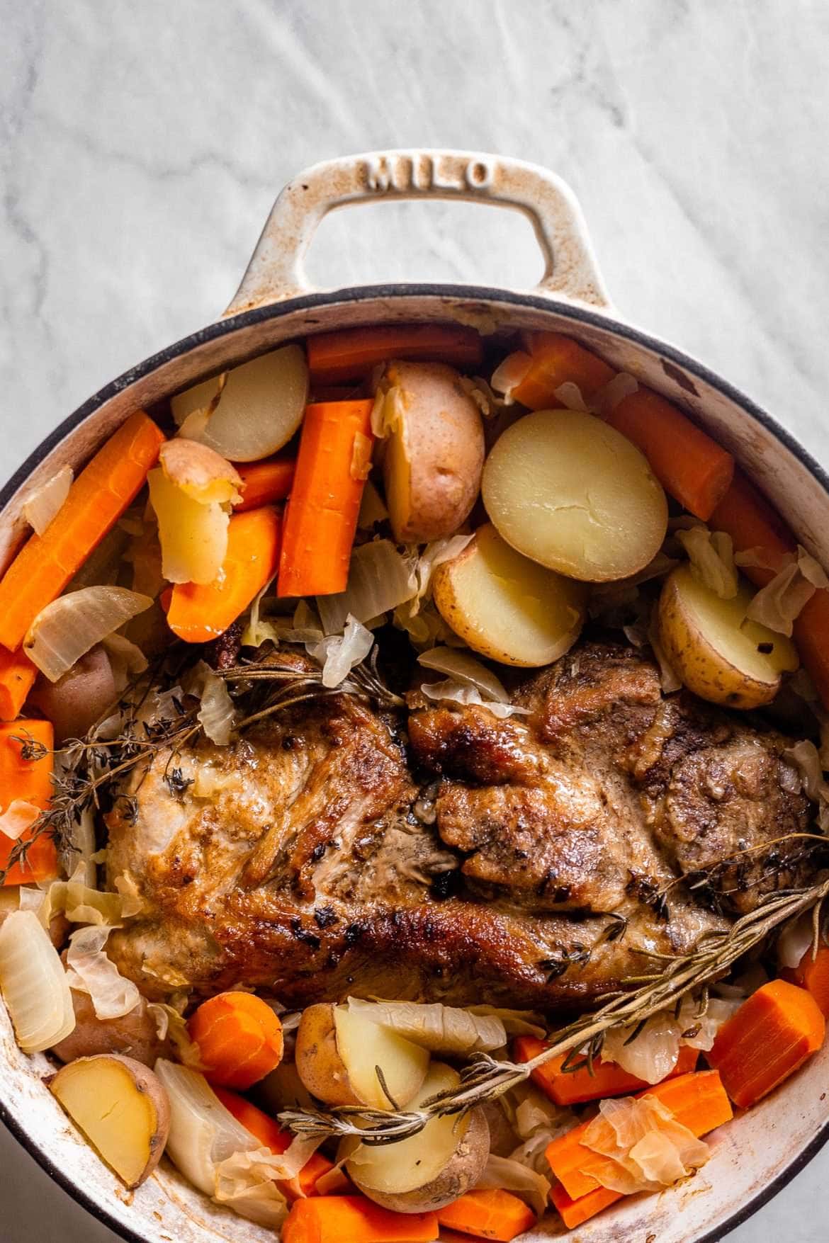 Slow Cooked Pork Roast with Sauerkraut Potatoes and Carrots