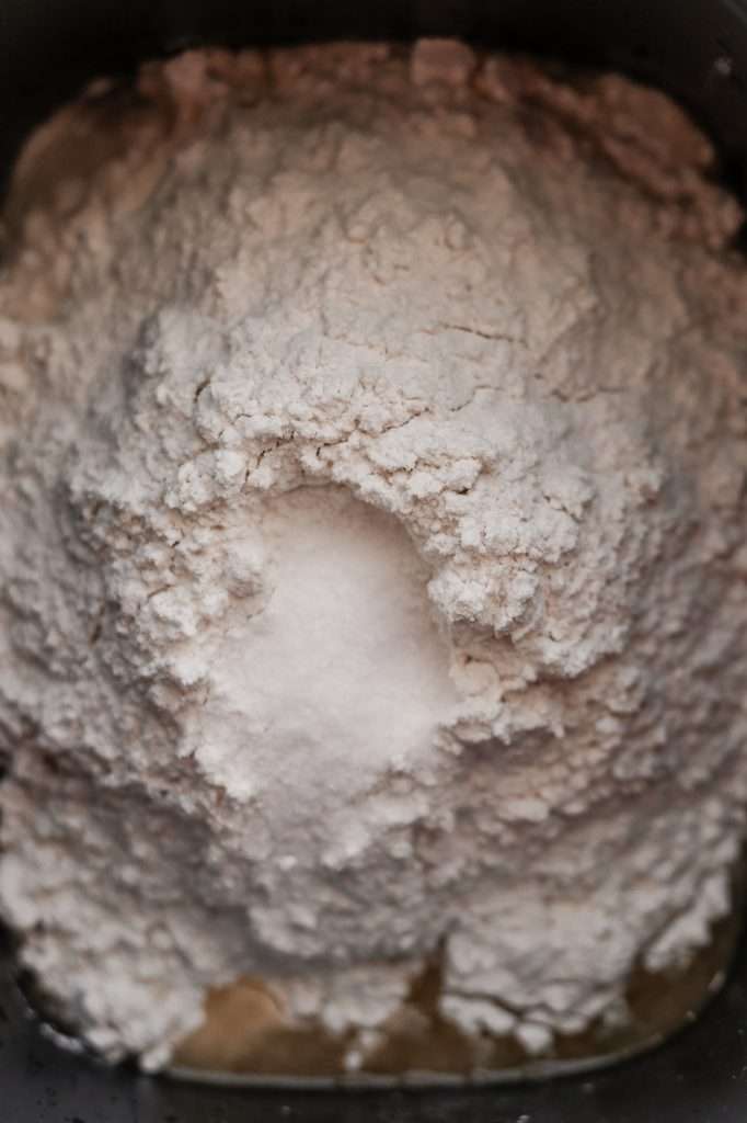 sourdough bread machine recipe dry ingredients added on top of the wet ingredients in the bread machine pan