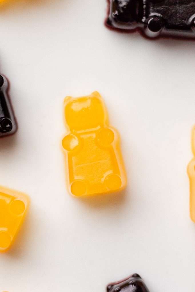 an orange protein gummy bear made with orange juice