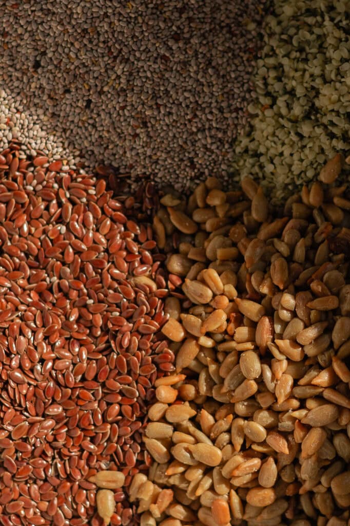 A dry mixture of seeds including hemp, shelled sunflower, chia, and flaxseed.