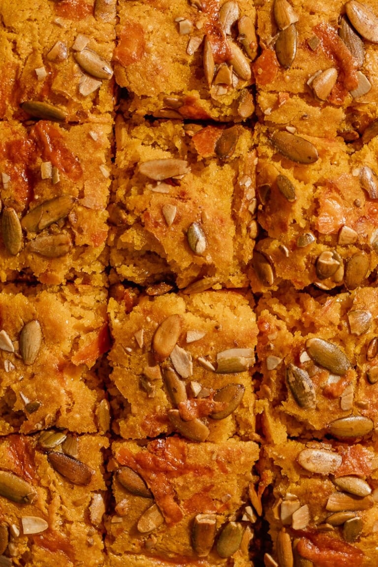 a close up shot of the cheddar butter cornbread to show the texture of the topping.